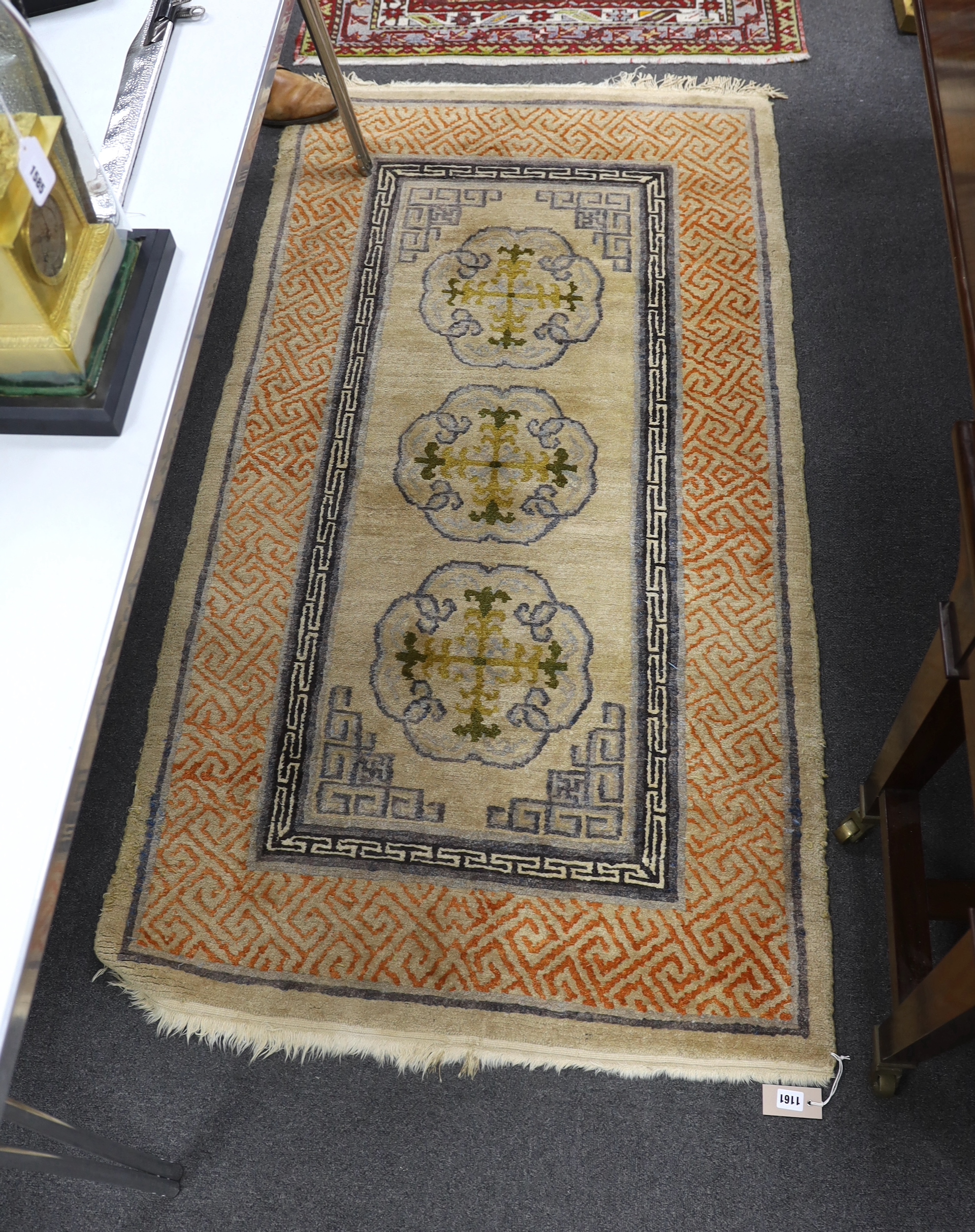 A Tibetan rug, 180 x 94cm